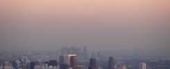 A view of a city skyline with a heavy layer of smog