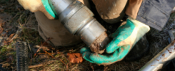 An environmental Engineer takes a soil sample
